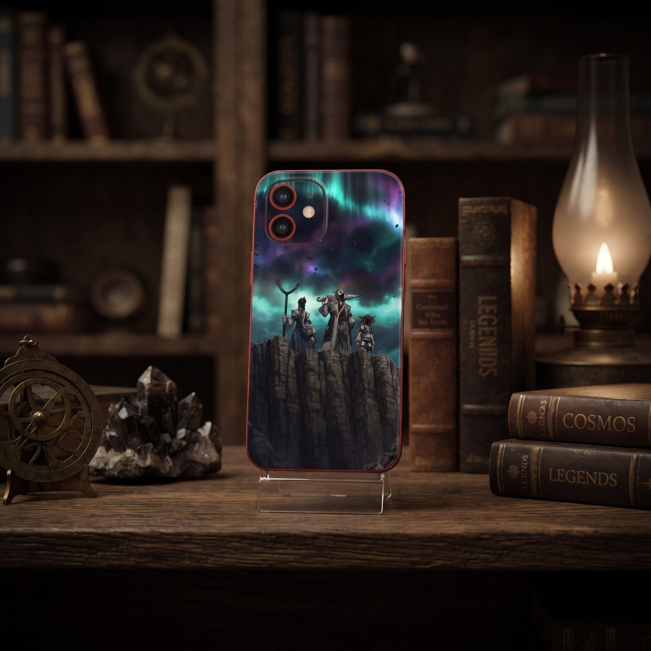 Coque iPhone Gachiakuta posée sur un bureau en bois près d'un astrolabe, d'un quartz et d'une lampe à pétrole