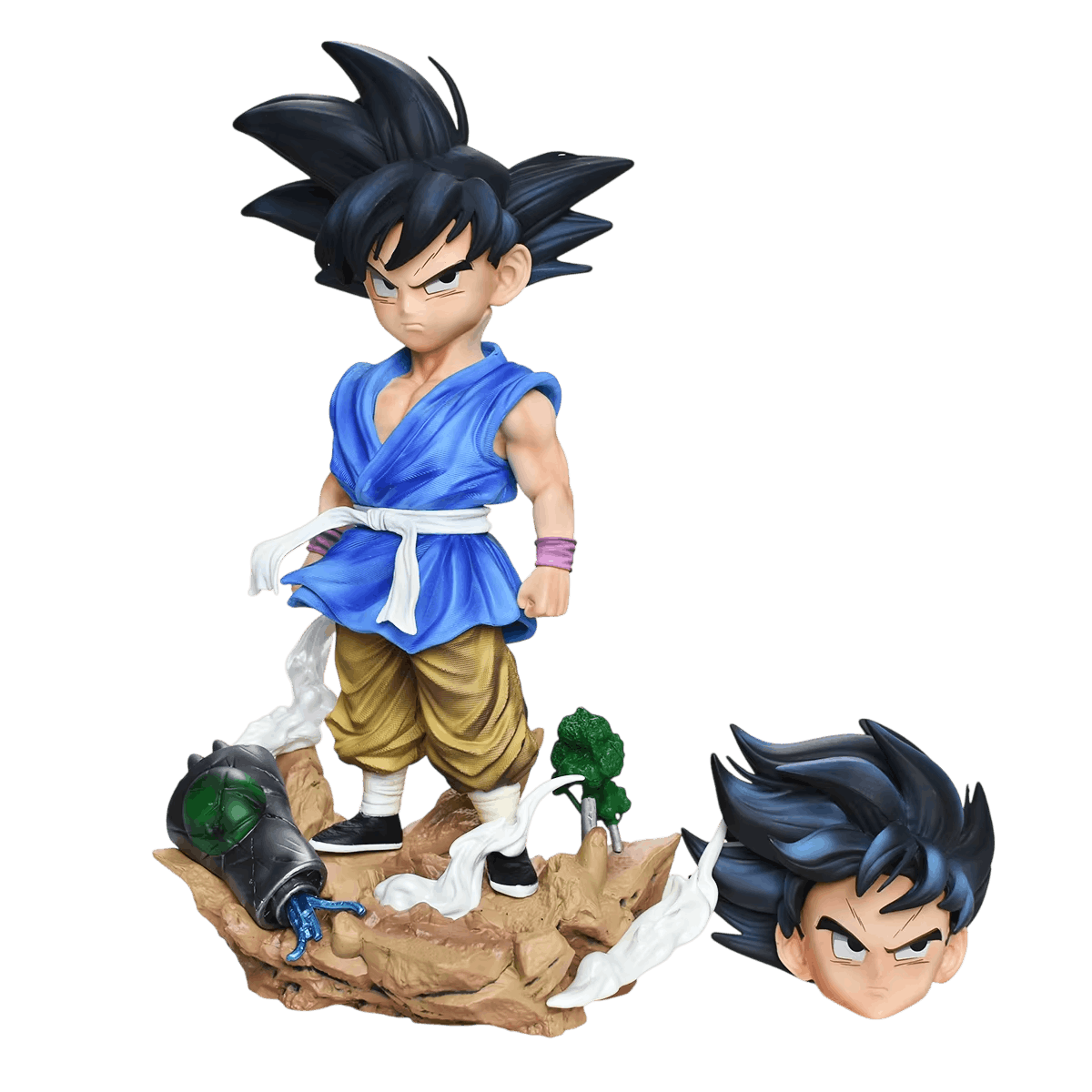 Figurine Goku enfant GT détourée sur fond noir avec sa seconde tête interchangeable posée à côté