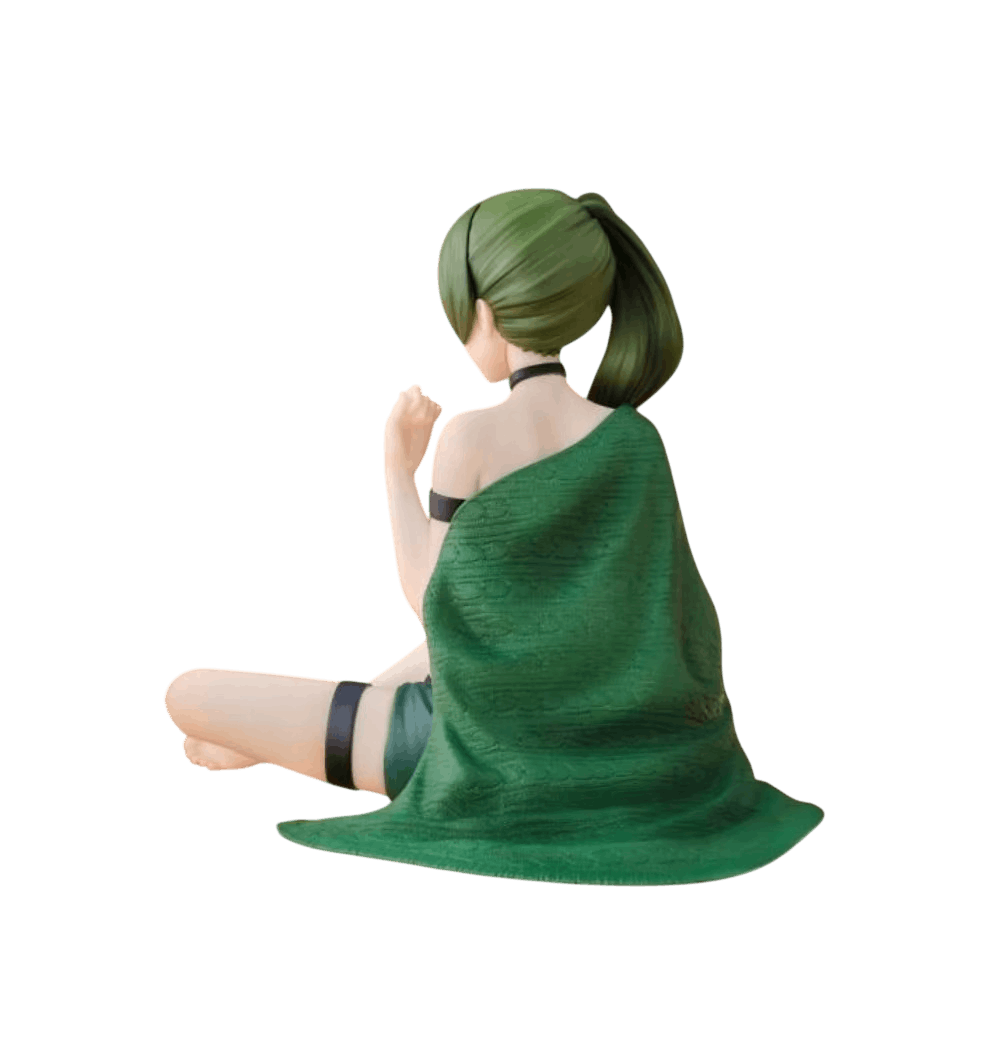 Figurine Übel Sousou no Frieren de dos : plaid vert tricoté retombant au sol, queue de cheval vert sombre