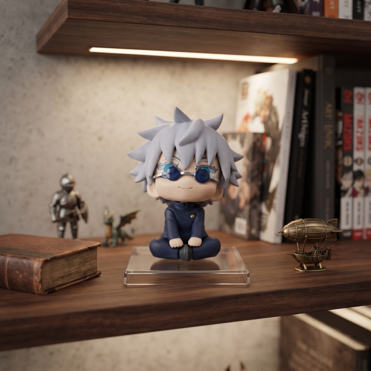 Figurine chibi Gojo Satoru assis en tailleur, exposée sur une étagère (décor non inclus)