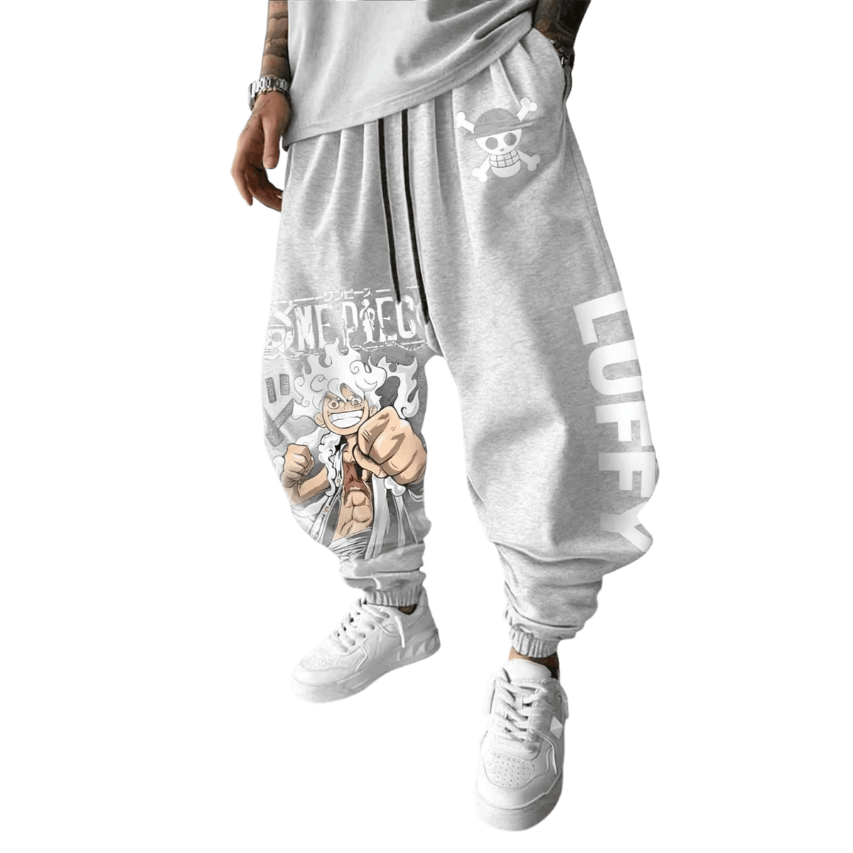 Light gray One Piece joggers, Jolly Roger on the hip, Luffy Gear 5 on the thigh and LUFFY down the other leg