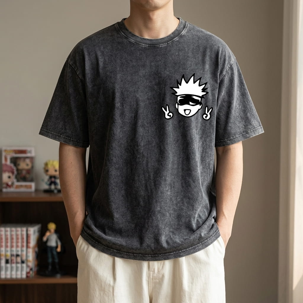 Washed black Jujutsu Kaisen T-shirt worn, a small chibi Satoru Gojo with black glasses flashing the V sign printed on the front (decor not included)