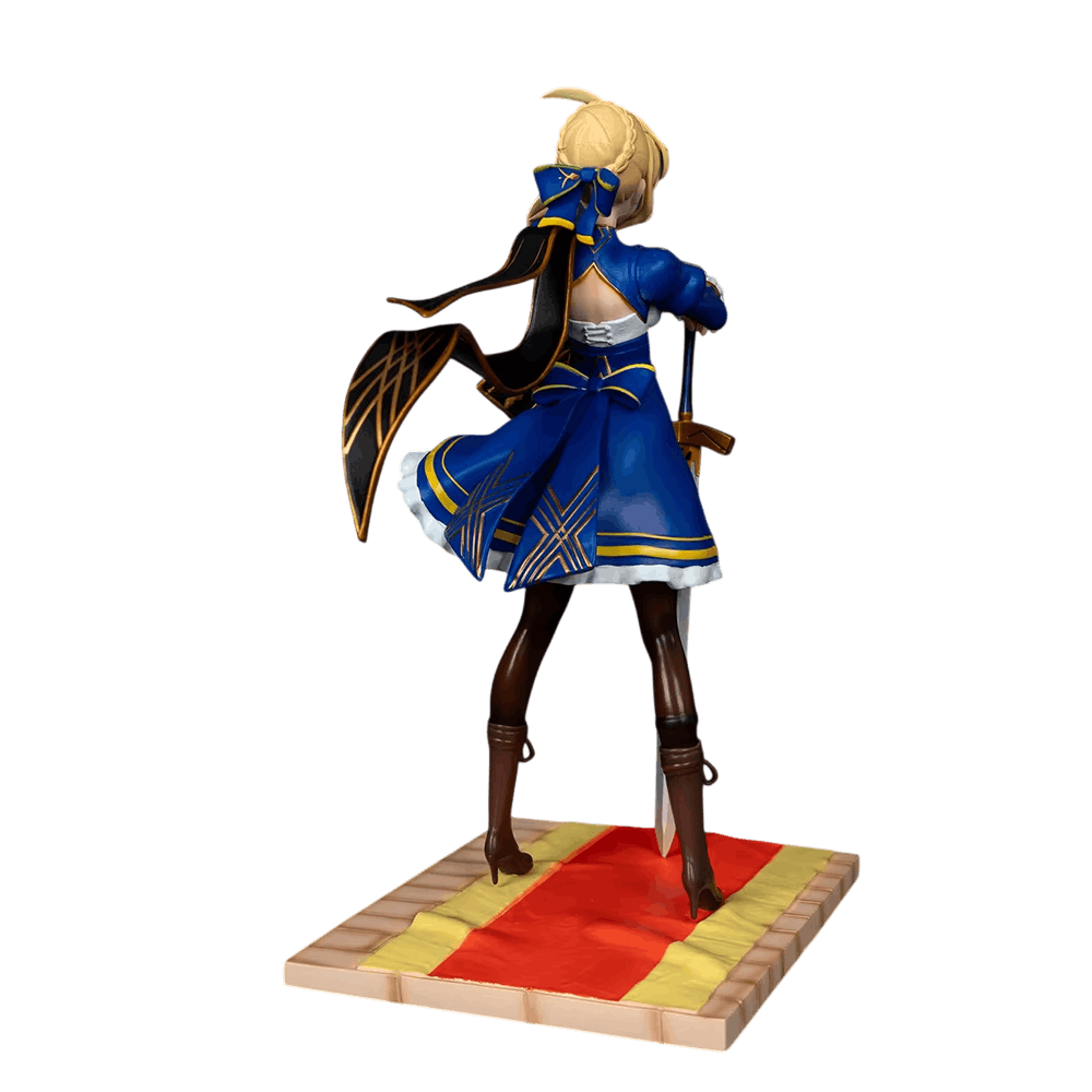 Fate Saber figure 25 cm rear three-quarter view: back cut away over white lacing, blue bow at the nape and half-cloak ribbed with gold
