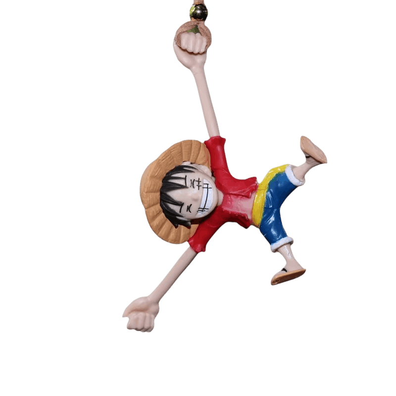 Figurine Luffy suspendue par le bras à sa chaînette, détourée sur fond blanc