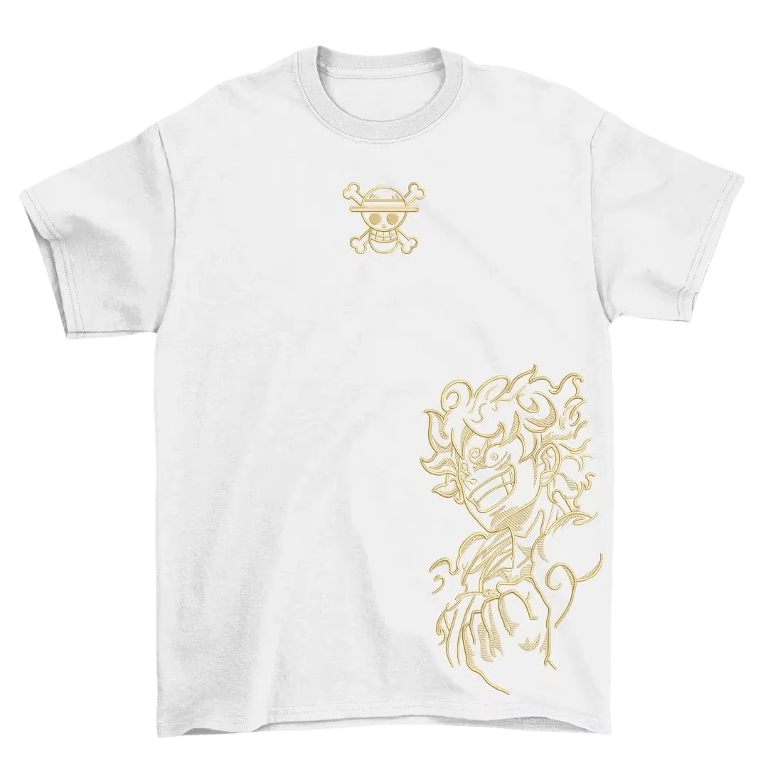 White One Piece T-shirt laid flat: the gold Jolly Roger on the chest and Luffy Gear 5 in gold at the bottom
